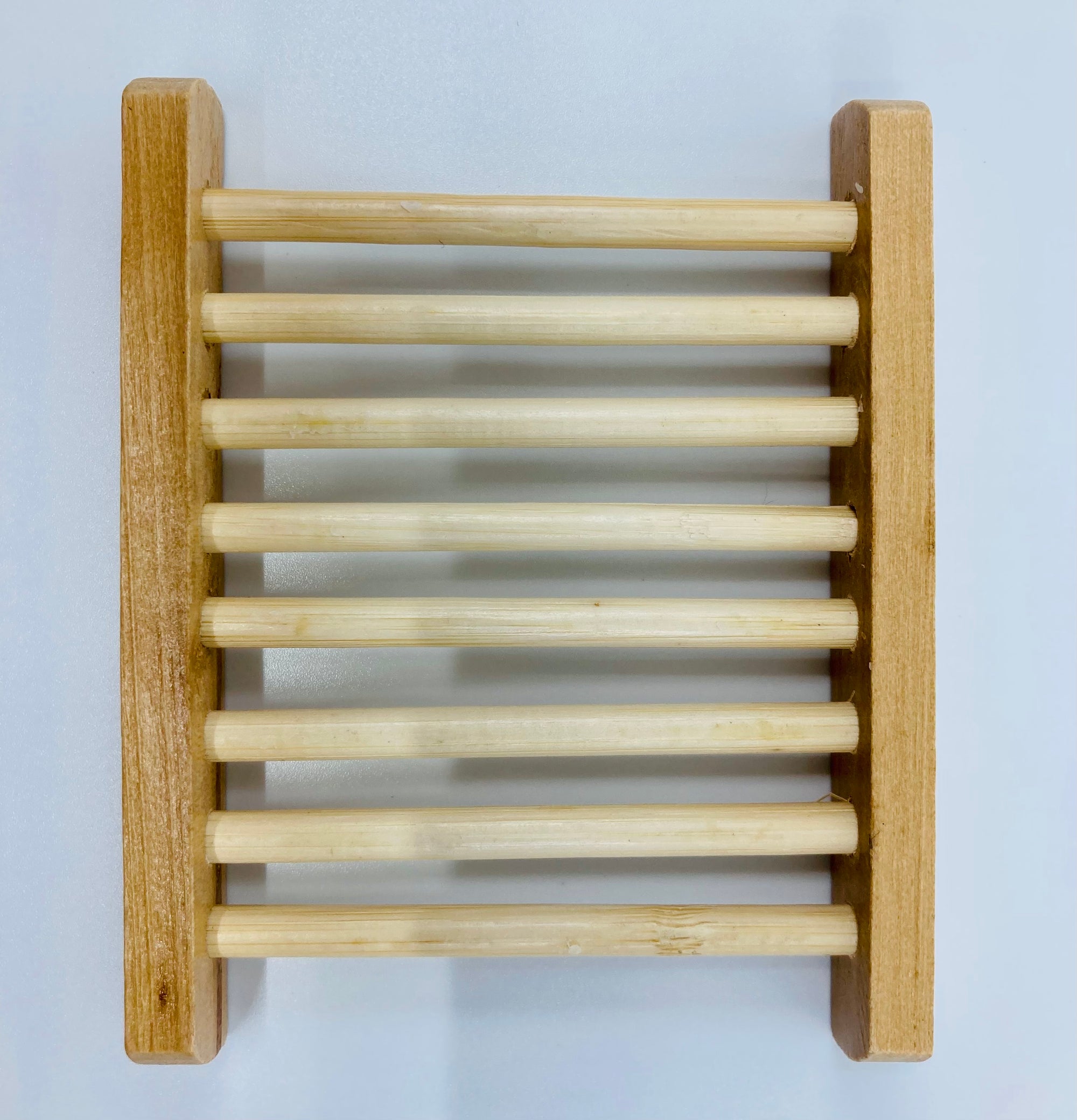 This bamboo soap dish is approximately 4 inches long and 3 inches wide.  It is made from 100% natural bamboo.  Please note that since bamboo is a natural resource, there may be color variations.