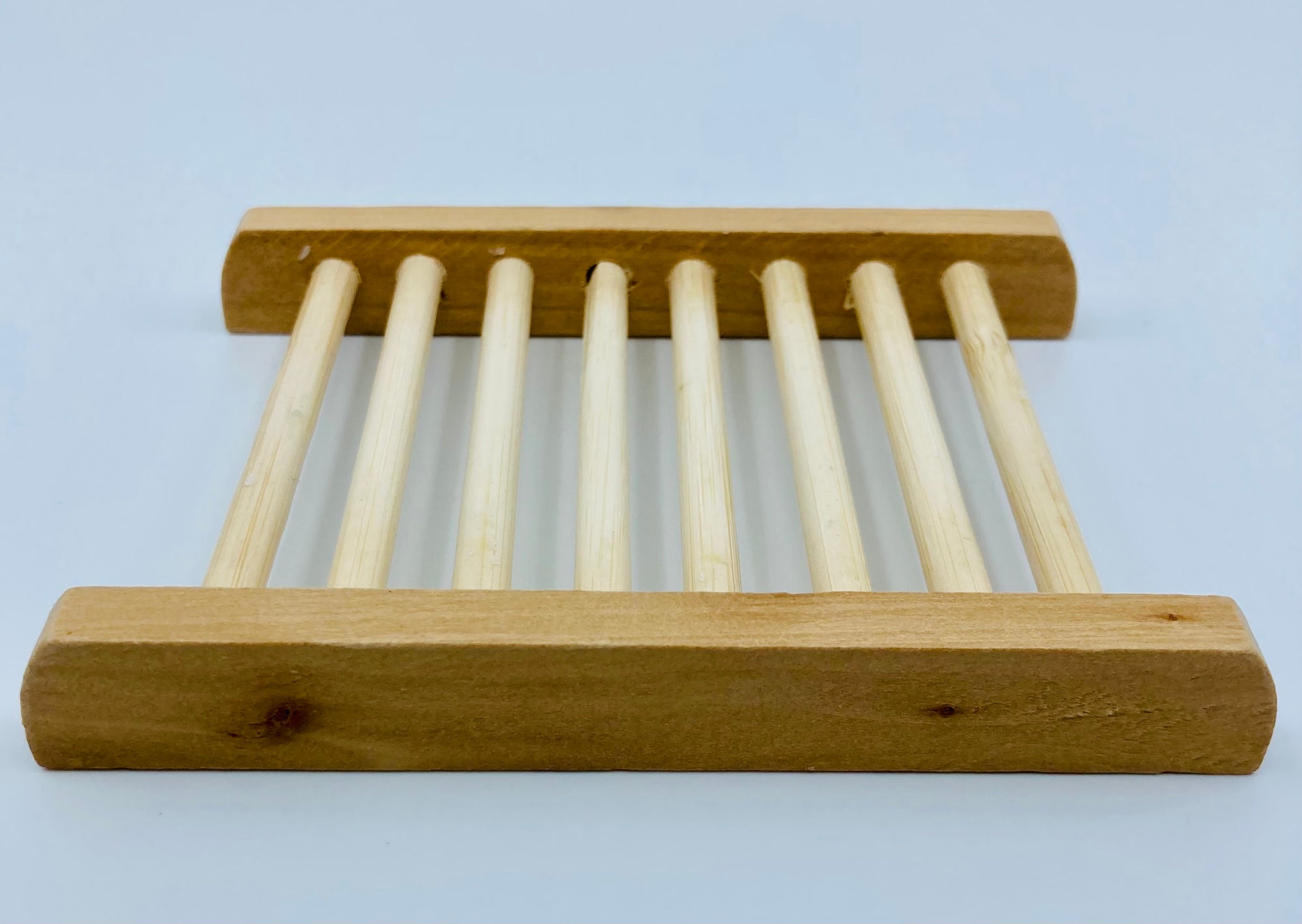 A side view of the bamboo soap dish.