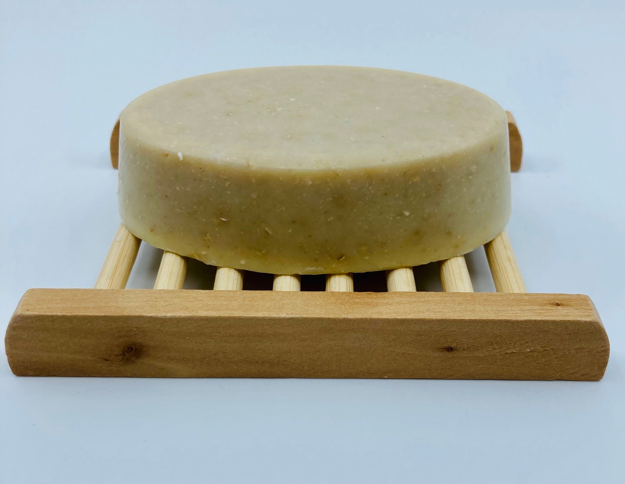 This bamboo soap dish is approximately 4 inches long and 3 inches wide.  It is made from 100% natural bamboo.  Please note that since bamboo is a natural resource, there may be color variations.